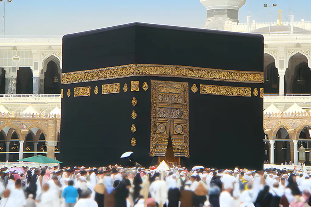 The Kaaba, draped in black cloth, surrounded by pilgrims performing Tawaf, the circumambulation ritual, in the sacred city of Mecca during Umrah.